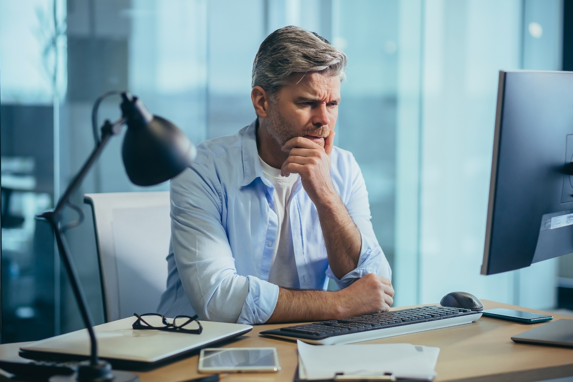 Business man in thought, solves important issues, and makes choices
