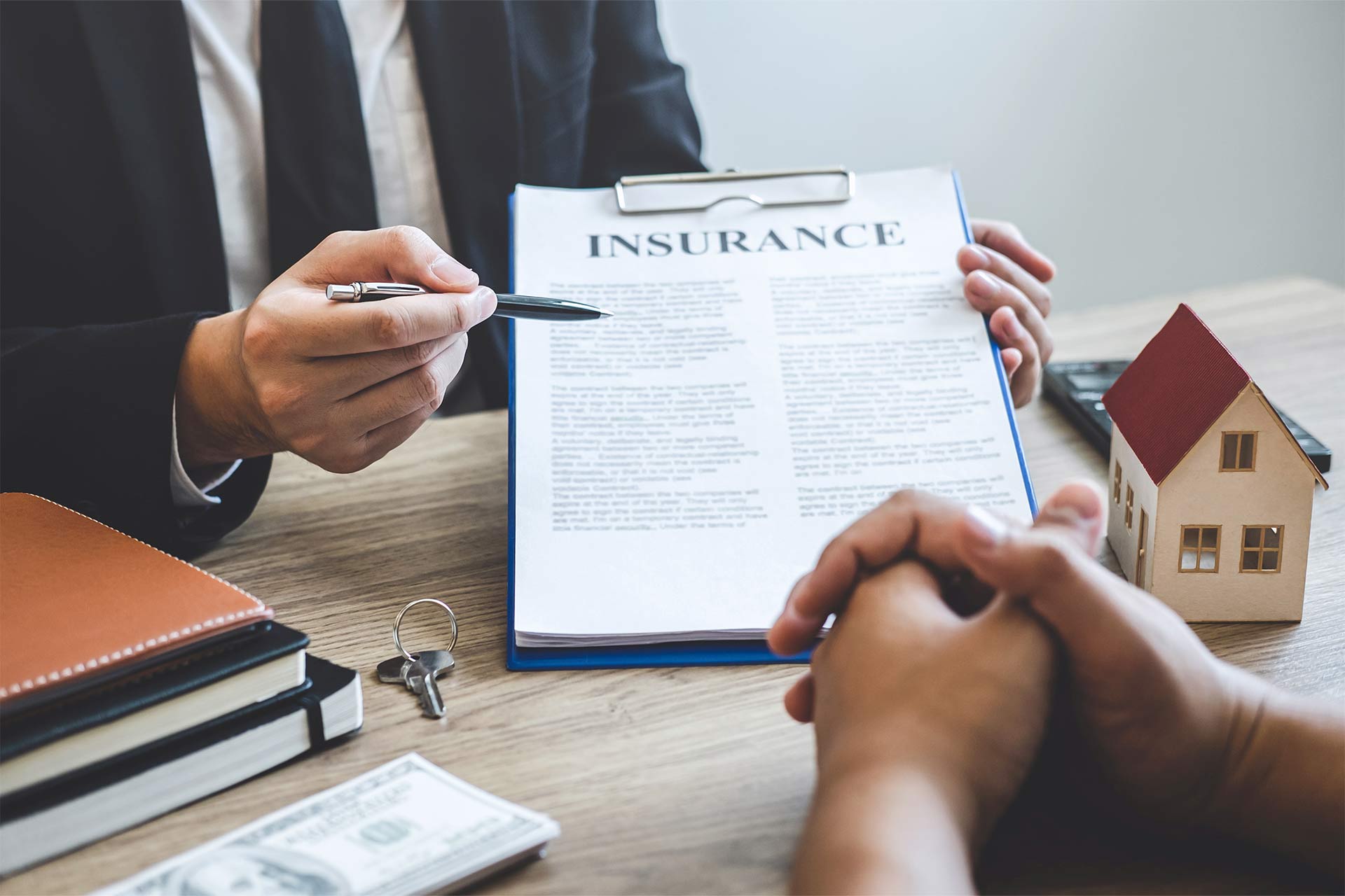 estate-agent-giving-house-and-keys-to-client-after-2023-11-27-05-25-43-CGNUM47